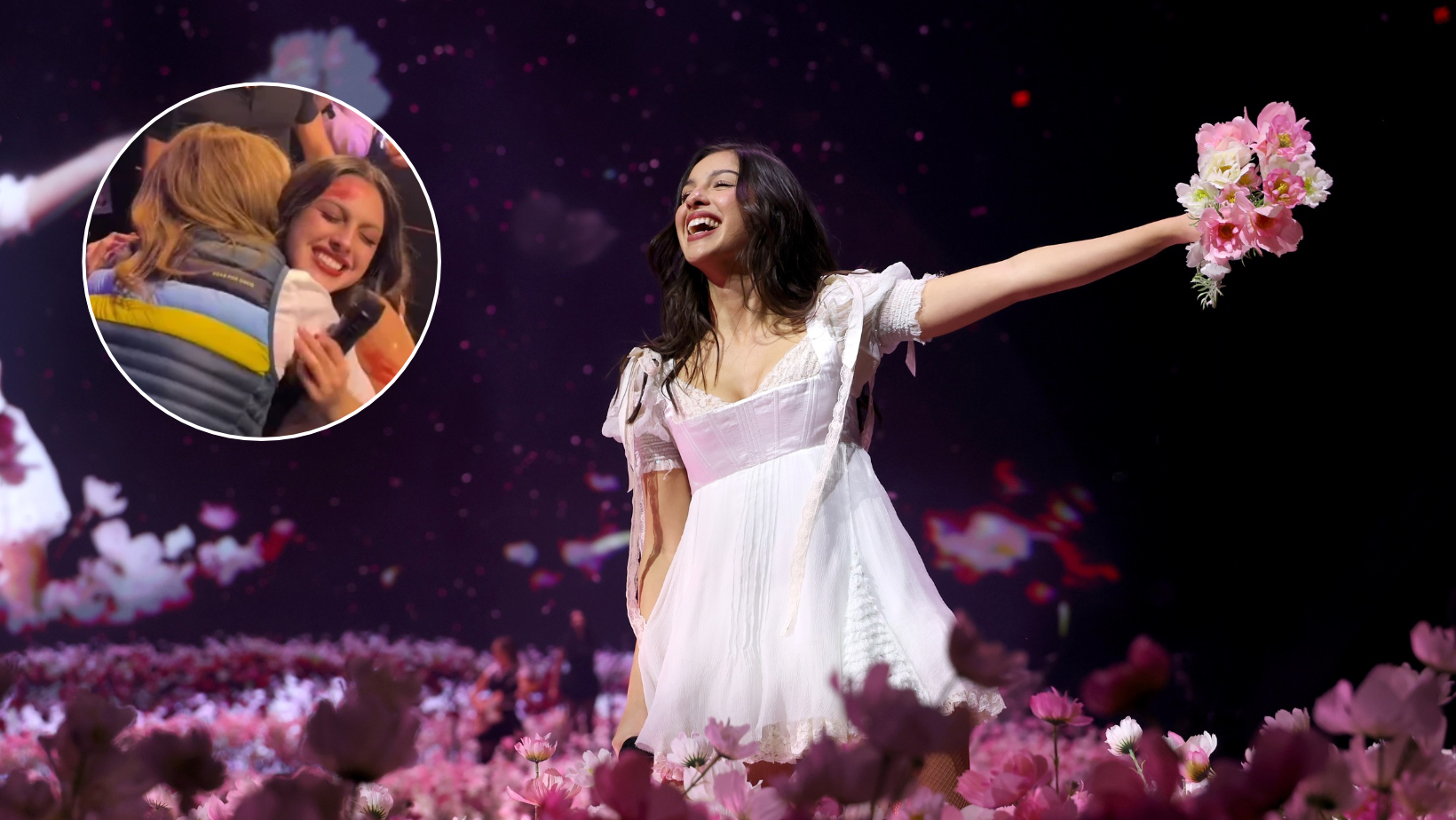 Olivia Rodrigo handing flowers to Amy Acton at Columbus concert