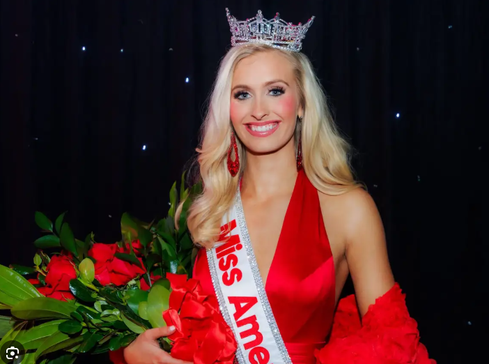 Former Miss America Madison Marsh Morris unveils street sign in Cincinnati.